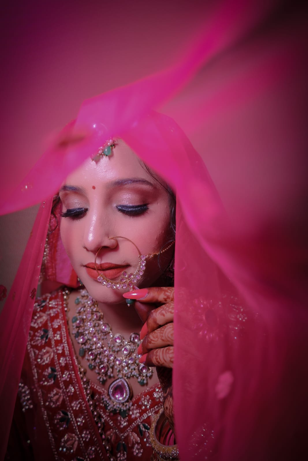 Elegant engagement makeup with a soft glow and glamorous finish.